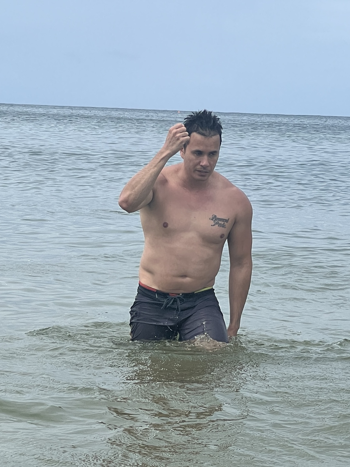 Casey standing in the sea on 1 January 2024, before his transformation
